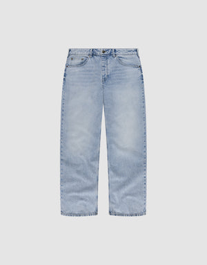 The LFDY Baggy Denim by LIVE FAST DIE YOUNG is a light blue, 100% cotton jean with a wide straight leg, classic five-pocket design, and relaxed baggy fit, shown laid flat on a plain white background. | plain