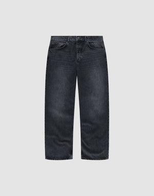 The LFDY Baggy Denim by LIVE FAST DIE YOUNG features a wide straight leg, dark-wash finish, and classic five-pocket design, shown against a plain light grey background. | plain