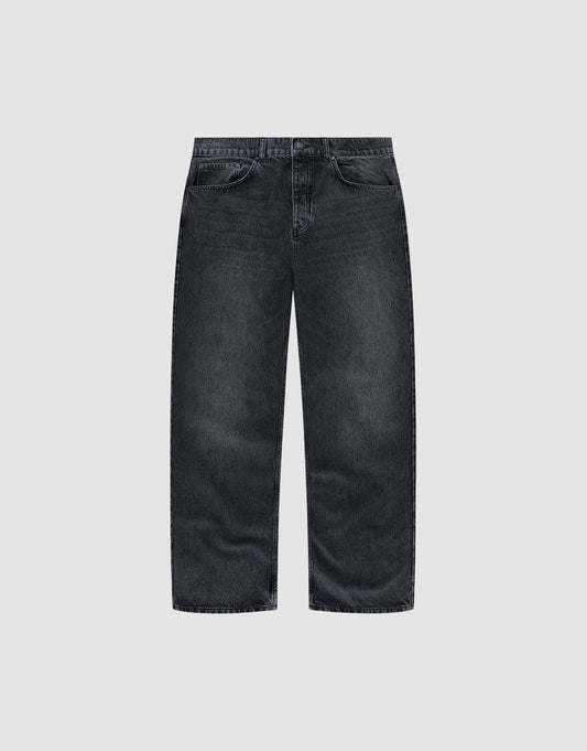 The LFDY Baggy Denim by LIVE FAST DIE YOUNG features a wide straight leg, dark-wash finish, and classic five-pocket design, shown against a plain light grey background. | plain