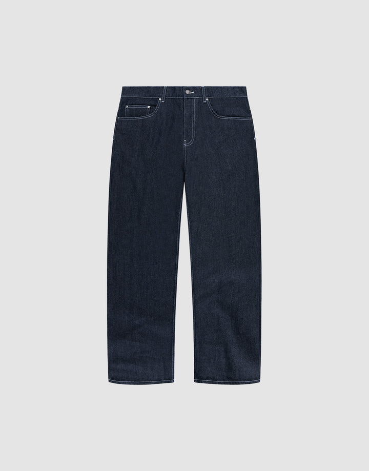 The LFDY Baggy Denim by LIVE FAST DIE YOUNG features dark blue raw-denim, a baggy straight-leg fit, white stitching, five pockets, and button closure in 100% cotton. Shown on a plain light grey background. | plain