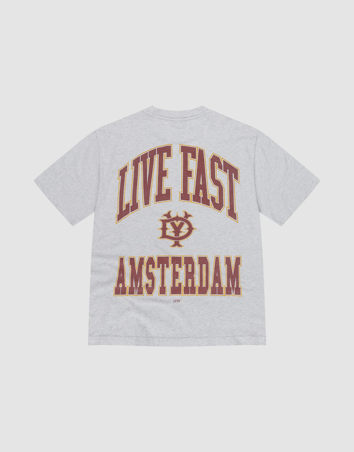 The Live Fast Amsterdam Tee by LIVE FAST DIE YOUNG is an oversized, light gray t-shirt made from 100% Baumwolle. It features large maroon and gold "LIVE FAST" text above a crest and bold "AMSTERDAM" lettering on the back. | plain
