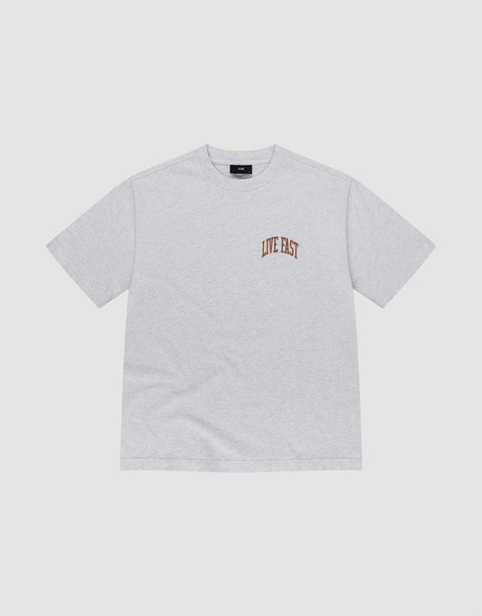 The Live Fast Amsterdam Tee by LIVE FAST DIE YOUNG is a light gray oversized short-sleeve t-shirt made from 100% cotton, featuring small brown "LIVE FAST" lettering on the left chest, shown on a white background.