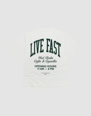 The Live Fast Coffee Tee by LIVE FAST DIE YOUNG is a white oversized T-shirt made from 100% Baumwolle, featuring bold front and back prints. Large black text on the back reads "LIVE FAST" with West Berlin Coffee & Cigarettes and opening hours below. | plain