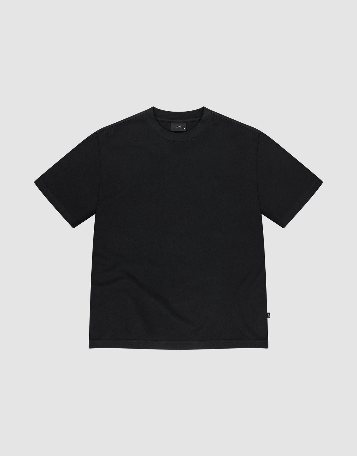 The LFDY Vintage Tee by LIVE FAST DIE YOUNG is a plain black short-sleeve crewneck with distressed edges, made from 100% Baumwolle, shown laid flat on a light grey background. | plain