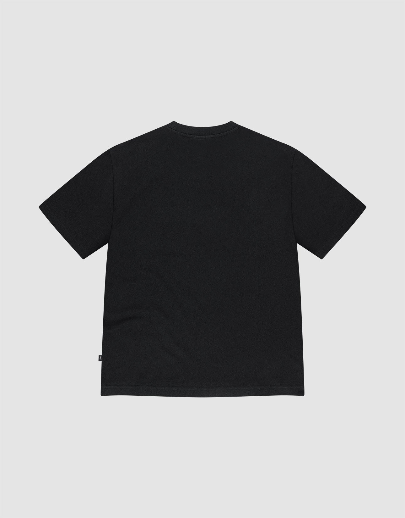 The LFDY Vintage Tee by LIVE FAST DIE YOUNG, in plain black with short sleeves and an oversize fit, is displayed from the back, laid flat on a light gray background.