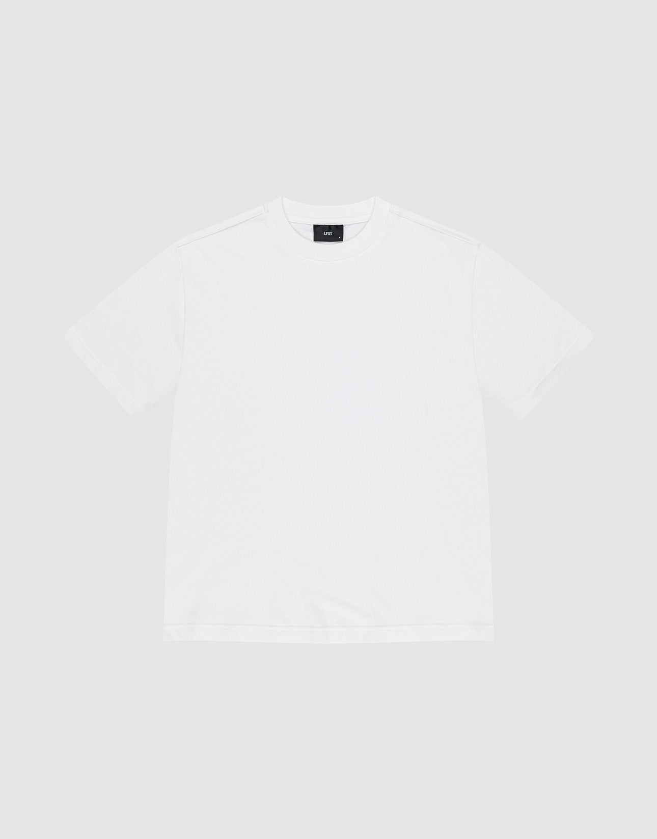 The LFDY Vintage Tee by LIVE FAST DIE YOUNG is a white short-sleeve shirt made from 100% Baumwolle, with distressed edges and a black inner collar tag, laid flat on a light gray background. | plain