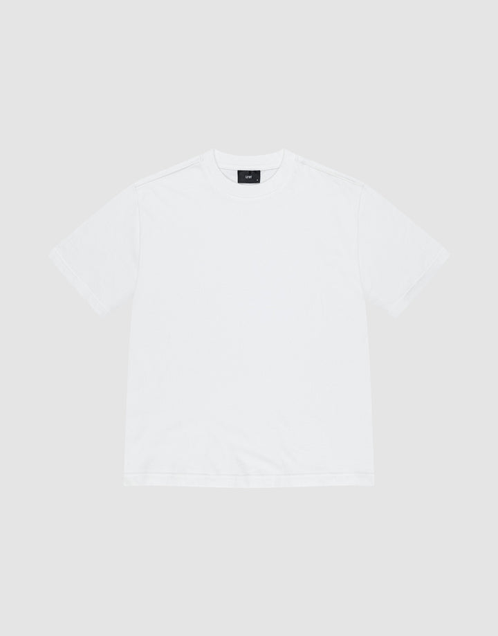 The LFDY Vintage Tee by LIVE FAST DIE YOUNG is a white short-sleeve shirt made from 100% Baumwolle, with distressed edges and a black inner collar tag, laid flat on a light gray background. | plain