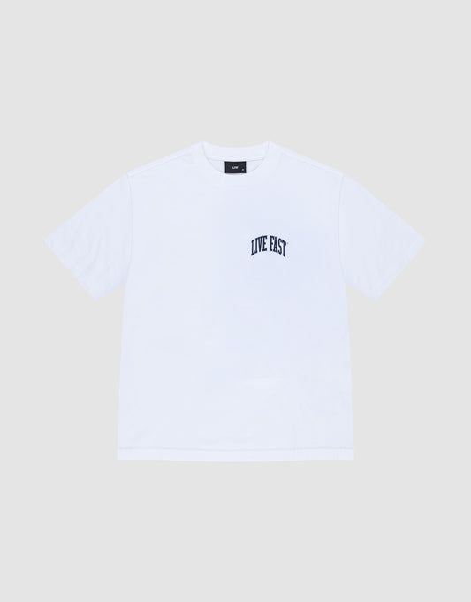 The LIVE FAST DIE YOUNG Live Fast London Tee is a plain white, oversize fit short-sleeve cotton t-shirt with "LIVE FAST" in black on the left chest, shown against a light gray background.