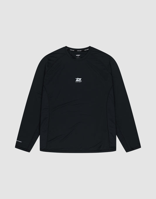 The LIVE FAST DIE YOUNG Live Fast Performance Longsleeve is a black slim-fit athletic shirt featuring a small white logo and text on the chest, plus more white text on the left sleeve and a reflective front print, shown on a plain light gray background. | plain