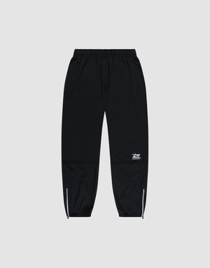 LIVE FAST DIE YOUNG’s Live Fast Performance Running Pants feature a black design with an elastic waistband, cuffed and zippered ankles, plus a small white logo on the left thigh, shown against a plain light gray background. | plain