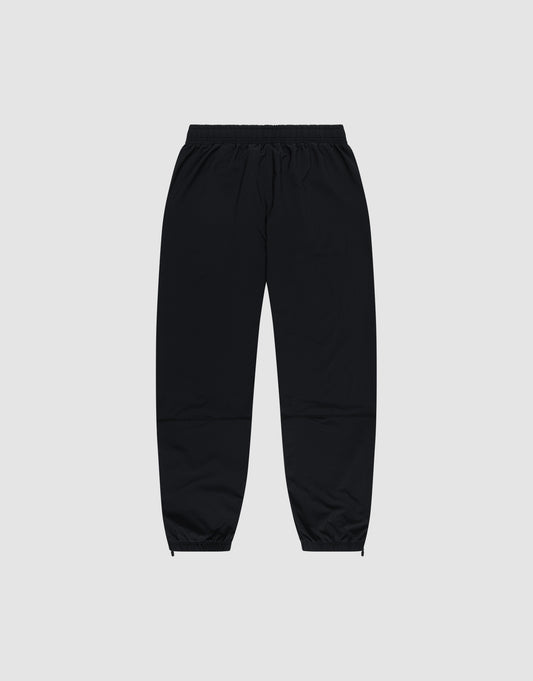 LIVE FAST DIE YOUNG's Live Fast Performance Running Pants feature an oversized fit, elastic waistband, and cuffed ankles, shown on a plain light gray background.