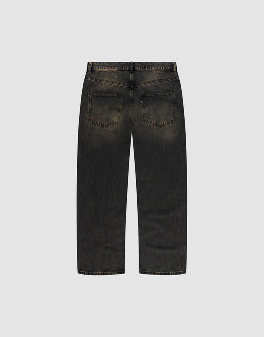 Back view of LFDY Baggy Denim by LIVE FAST DIE YOUNG in black, slightly faded 100% Baumwolle, featuring weites gerades Bein (wide straight leg), baggy fit, two rear pockets, and visible seams on a plain light gray background.