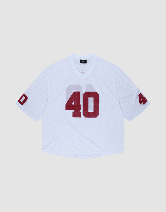 The LFDY Mesh Jersey by LIVE FAST DIE YOUNG is a white polyester football jersey with an oversize fit, short sleeves, and bold red number 40 on the front and sleeves. It features a V-neck collar and is shown on a light gray background. | plain