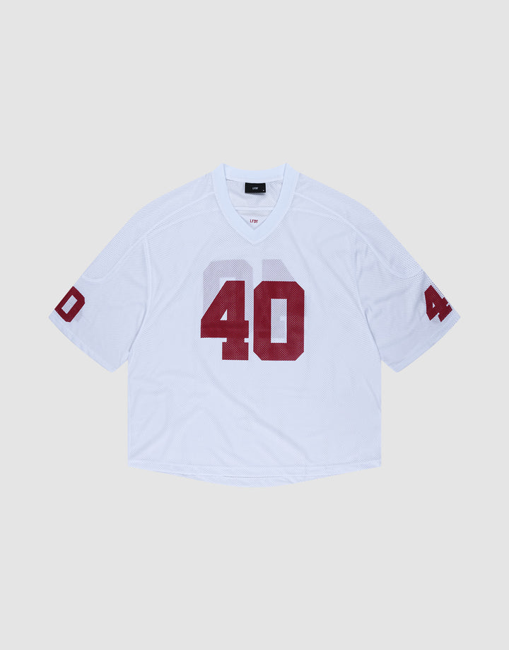 The LFDY Mesh Jersey by LIVE FAST DIE YOUNG is a white polyester football jersey with an oversize fit, short sleeves, and bold red number 40 on the front and sleeves. It features a V-neck collar and is shown on a light gray background. | plain
