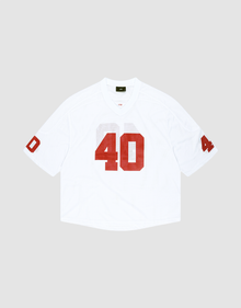 The LFDY Mesh Jersey by LIVE FAST DIE YOUNG is a white polyester football jersey with an oversize fit, short sleeves, and bold red number 40 on the front and sleeves. It features a V-neck collar and is shown on a light gray background. | plain
