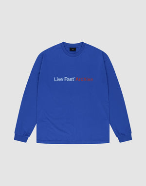 The LIVE FAST DIE YOUNG "Live Fast Archive Longsleeve" is a blue, 100% Baumwolle oversized tee featuring bold white "Live Fast" and red "Archive" frontprints, shown laid flat on a light background. | plain
