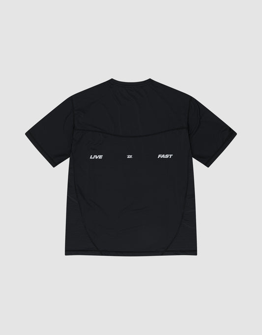 A black Live Fast Performance Tee by LIVE FAST DIE YOUNG, slim fit and short-sleeve, made of Nylon Spandex, with "LIVE" and "FAST" in white reflective print spaced across the upper back.
