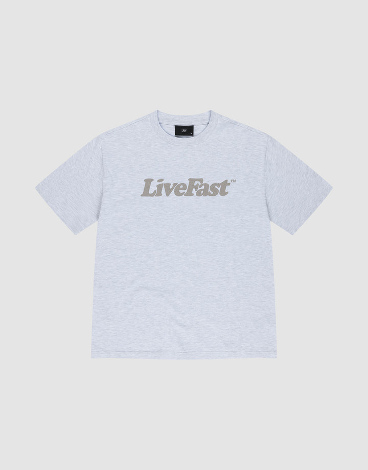 The Basic Tee by LIVE FAST DIE YOUNG is a light gray oversized cotton t-shirt with "Live Fast" boldly printed in dark gray across the chest, shown against a white background. | plain
