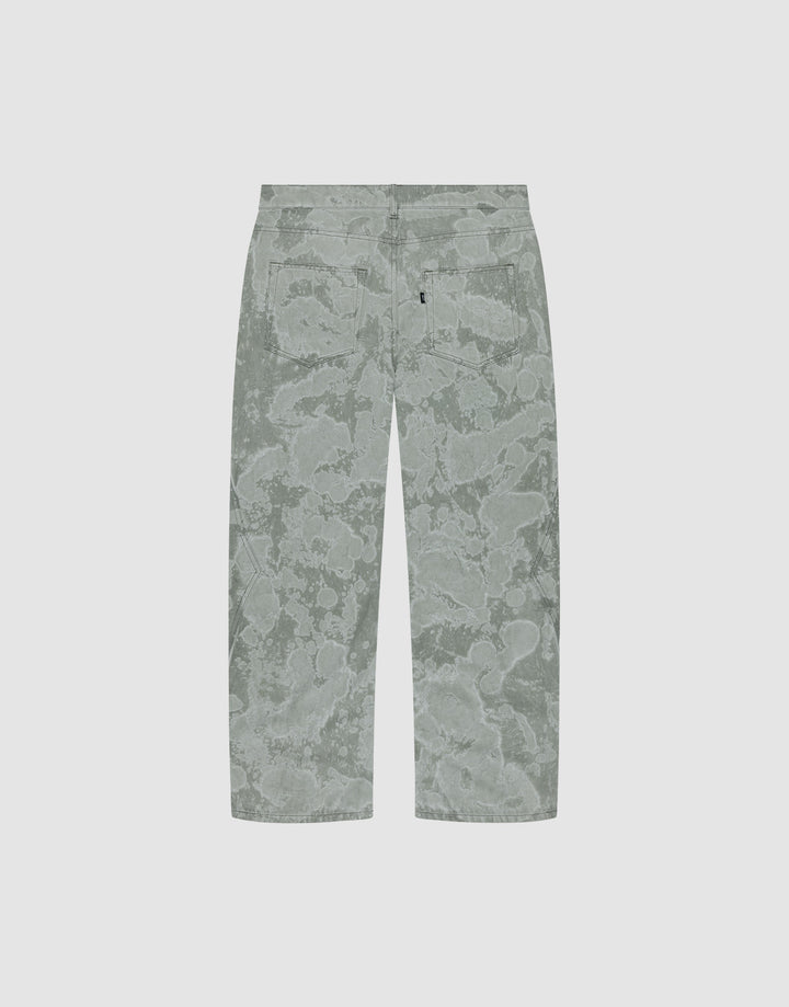 Back view of the Rhomb Wide Denim by LIVE FAST DIE YOUNG: baggy, light grey-green pants with an abstract floral/cloud pattern and two back pockets, featuring wide straight legs. Made from 100% cotton and shown on a plain light background.