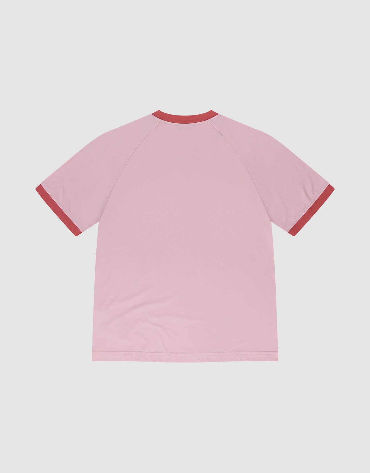 The Live Fast Contrast Tee by LIVE FAST DIE YOUNG is a light pink short-sleeve shirt with raglan sleeves, shown from the back, featuring dark red collar and cuffs, displayed on a plain white background.