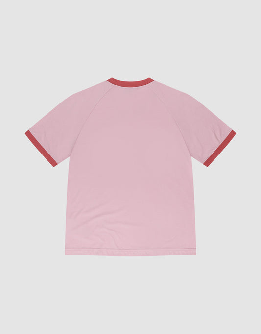 The Live Fast Contrast Tee by LIVE FAST DIE YOUNG is a light pink short-sleeve shirt with raglan sleeves, shown from the back, featuring dark red collar and cuffs, displayed on a plain white background.