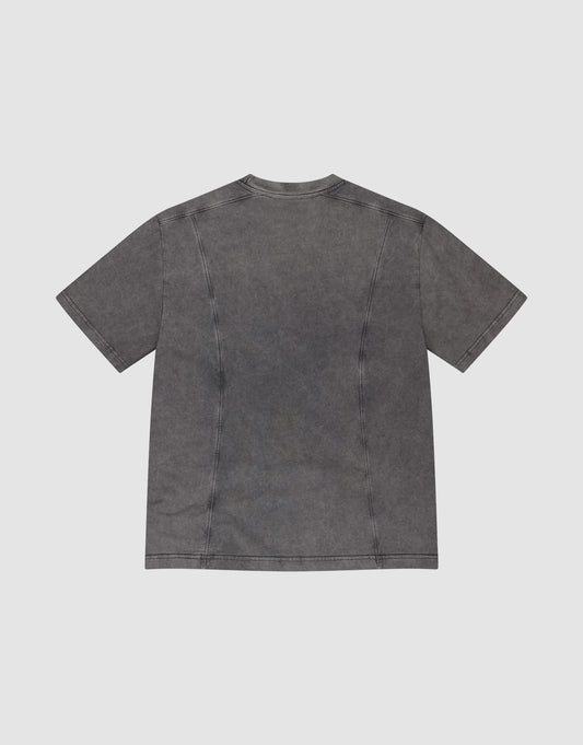 The Live Fast Wave Tee by LIVE FAST DIE YOUNG is a washed black, plain short-sleeve t-shirt with visible seams and no graphics, shown from the back against a light gray background for a relaxed, casual look.