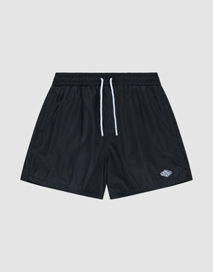 The Basic Satin Shorts by LIVE FAST DIE YOUNG are black polyester athletic shorts with an elastic waistband, white drawstrings, and a small white logo on the lower left leg, shown against a plain light gray background. | plain