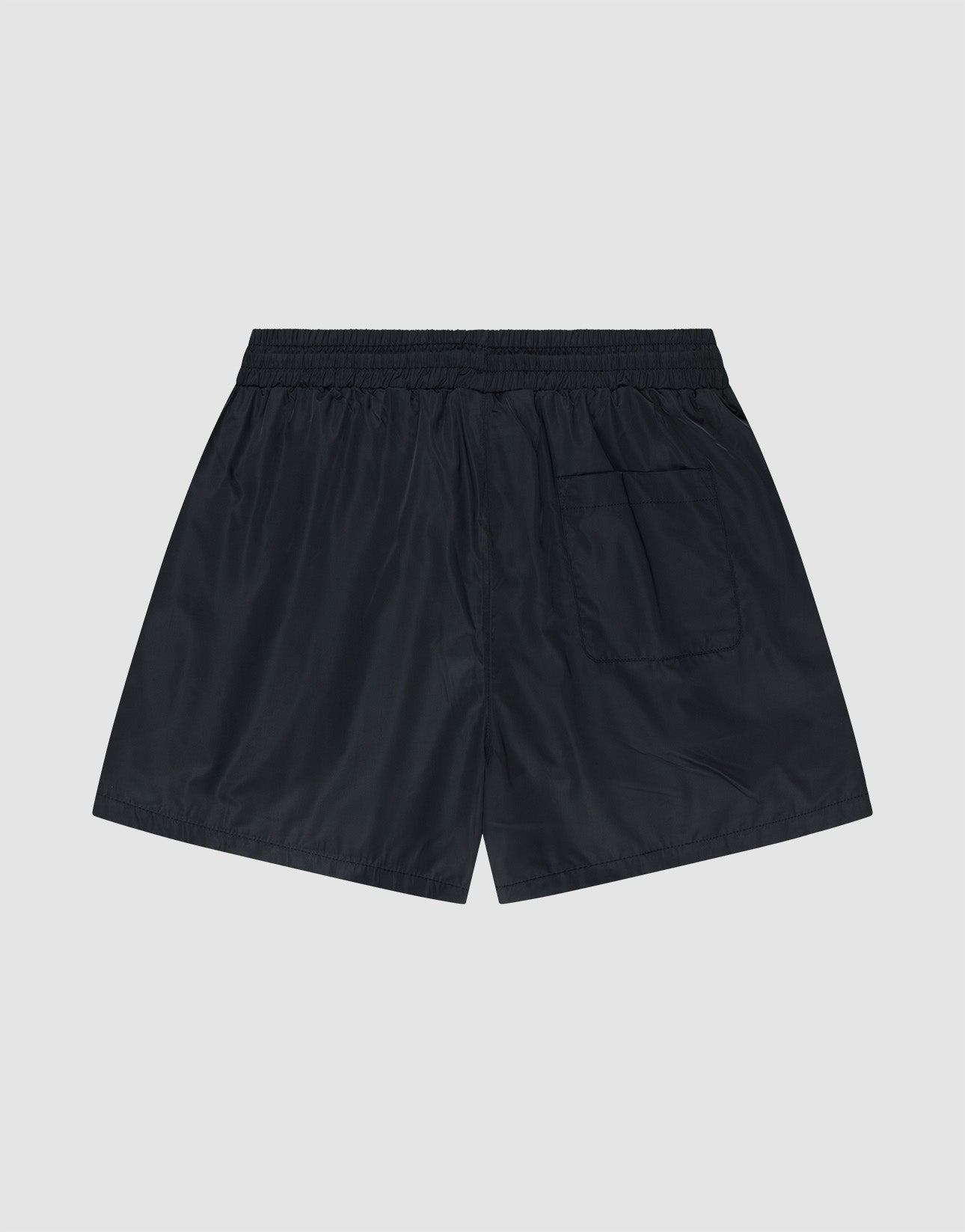 LIVE FAST DIE YOUNG Basic Satin Shorts in black, featuring an elastic waistband and a single back pocket, are crafted from lightweight polyester and shown flat on a light gray background.