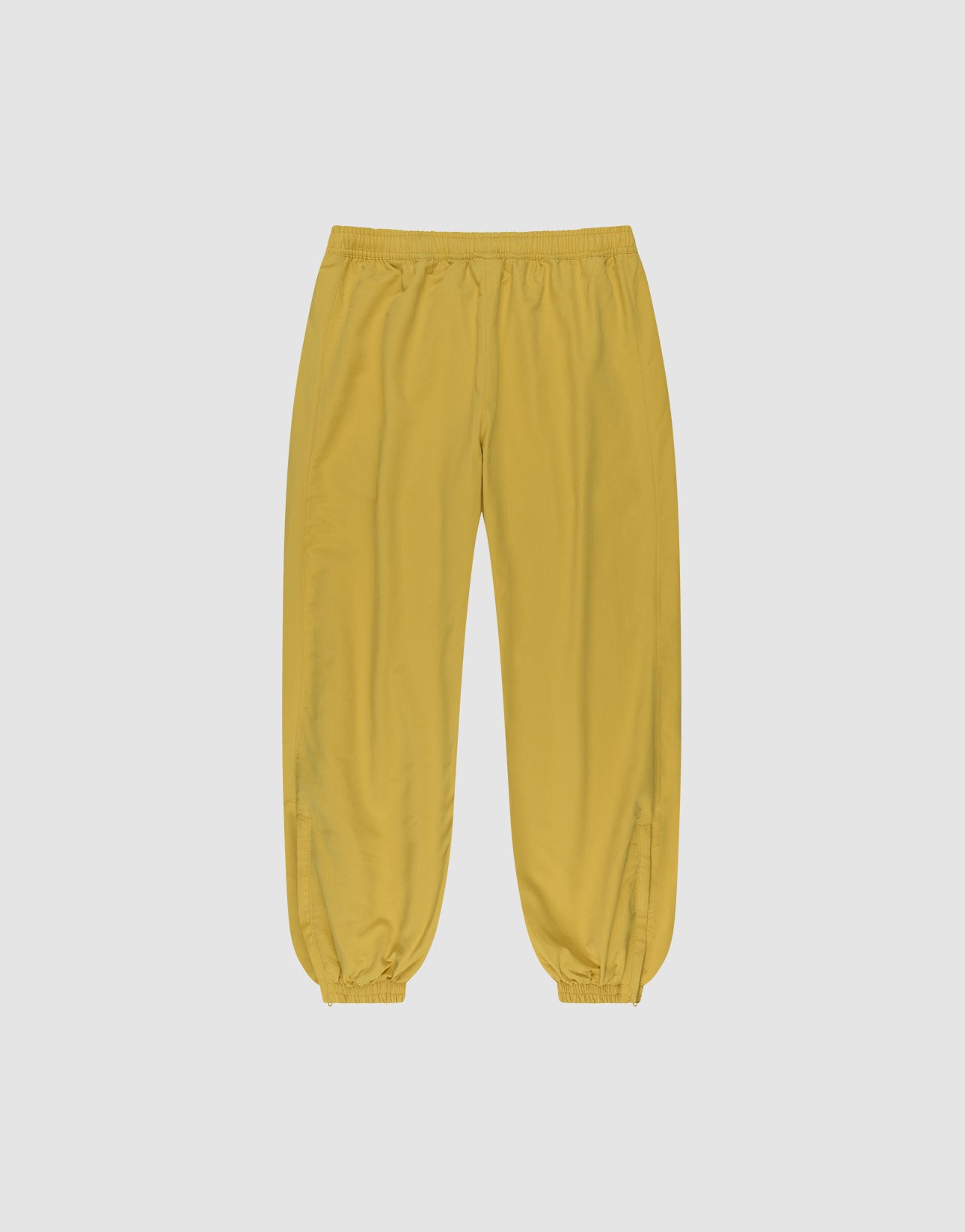 The LFDY Trackpants by LIVE FAST DIE YOUNG feature a yellow regular fit, elastic waistband and cuffs, and reflective print, shown against a plain light gray background.