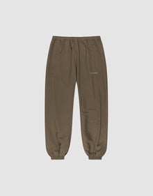 The LFDY Trackpants by LIVE FAST DIE YOUNG feature a regular fit, elastic waistband and cuffs, two side pockets, and a small reflective white logo on the left thigh. Made from soft polyester, shown on a light gray background. | plain