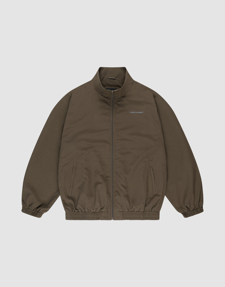 The LFDY Trackjacket by LIVE FAST DIE YOUNG is a brown zip-up with a stand collar, elastic cuffs and hem, oversize fit, two side pockets, and small white "LIMPIDUNIT" text on the left chest. Displayed on a plain white background. | plain