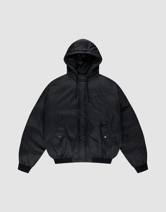 The LFDY Winter Bomber Jacket by LIVE FAST DIE YOUNG is a black oversized puffer with a hood and drawstrings, front snap-button pockets, ribbed cuffs, and hem, shown on a light gray background. | plain