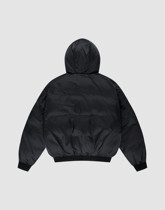 The LFDY Winter Bomber Jacket by LIVE FAST DIE YOUNG is a black puffer with Oversize Fit and hood with drawstrings, shown from the back on a light gray background. It features long sleeves, ribbed cuffs, and a ribbed hem.