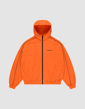 The LIVE FAST DIE YOUNG Live Fast Trackjacket is bright orange with a black zipper, zippered pockets, black sleeve piping, elastic cuffs and hem, and a subtle left chest logo. Displayed against a plain light gray background. | plain