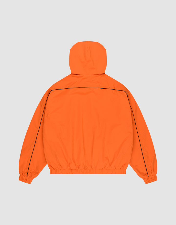 The Live Fast Trackjacket by LIVE FAST DIE YOUNG is a bright orange nylon jacket with black piping on the shoulders and sleeves, zippered side pockets, elastic cuffs and waistband, shown from the back on a light gray background.