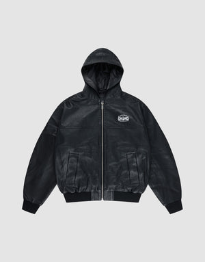 The LIVE FAST DIE YOUNG Leather Hooded Jacket is a black oversized zip-up with a subtle sheen, ribbed cuffs and hem, and a small white logo on the left chest, shown against a plain gray background. | plain