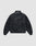 The Live Fast Leather Trackjacket by LIVE FAST DIE YOUNG is shown from the back on a light gray background, featuring a stand collar, relaxed fit, elastic cuffs and waistband, plus a subtly embossed logo.