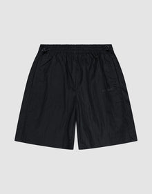 The LIVE FAST DIE YOUNG Live Fast Nylon Shorts feature an oversized fit, elastic waistband (Elastikbund), subtle side pockets, and a slightly wrinkled texture, shown flat on a plain light gray background. | plain