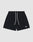 The Basic Mesh Shorts by LIVE FAST DIE YOUNG feature black polyester mesh, a regular fit, elastic waistband with white drawstrings, and a small white embroidered logo on the lower left leg. Shown against a light gray backdrop.