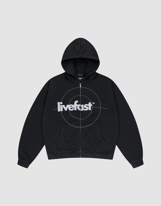 The LIVE FAST DIE YOUNG Live Fast Target Hooded Zip is a black oversized hoodie with front pockets, a hood, and bold "livefast" text over a circular chest design, displayed on a plain light gray background.