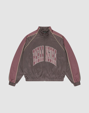The LFDY x Baba Angora Trackjacket by LIVE FAST DIE YOUNG is a brown and mauve zip-up with beige sleeve piping, "BARBA NDORA" across the chest, an oversized fit, and elastic cuffs and hem for comfort. | plain