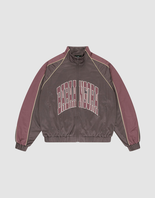 The LFDY x Baba Angora Trackjacket by LIVE FAST DIE YOUNG is a brown and mauve zip-up with beige sleeve piping, "BARBA NDORA" across the chest, an oversized fit, and elastic cuffs and hem for comfort. | plain