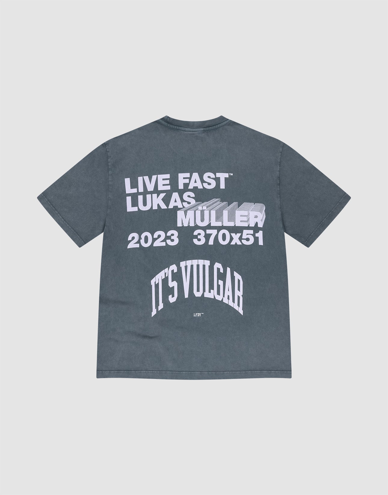 The It's Vulgar Tee by LIVE FAST DIE YOUNG is a dark gray, 100% cotton oversized T-shirt with white front text and a blurred car back print reading "LIVE FAST LUKAS MÜLLER 2023 370x51 ITS VULGAR.