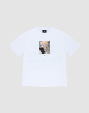 The LFDY Sharkhunter Tee by LIVE FAST DIE YOUNG is an oversized white T-shirt with a rectangular abstract, blurry graphic on the chest in muted colors. Made from 100% Baumwolle, shown against a light gray background. | plain