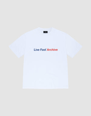 The Live Fast Archive Tee by LIVE FAST DIE YOUNG is a white oversized t-shirt made from 100% Baumwolle with a bold "Live Fast" print in dark blue and "Archive" in red on the front, set on a plain light gray background | plain