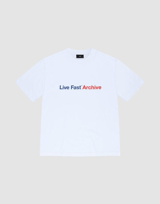 The Live Fast Archive Tee by LIVE FAST DIE YOUNG is a white oversized t-shirt made from 100% Baumwolle with a bold "Live Fast" print in dark blue and "Archive" in red on the front, set on a plain light gray background.