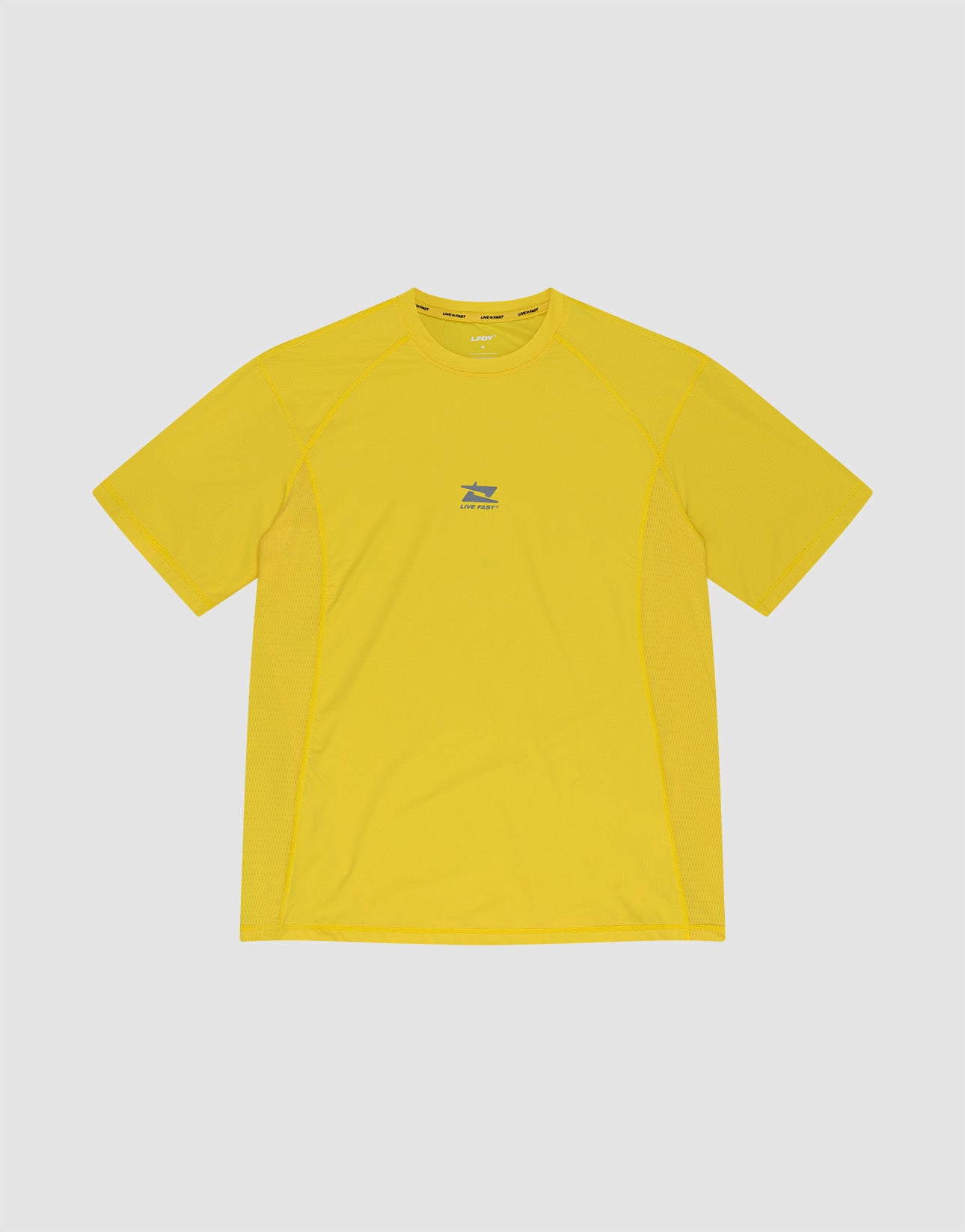 The LIVE FAST DIE YOUNG Live Fast Performance Tee is a bright yellow slim fit short-sleeve athletic shirt made from soft nylon spandex, featuring a small blue and white chest logo, shown on a plain light gray background.
