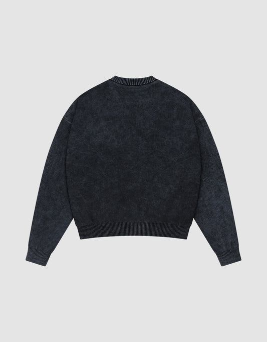The LIVE FAST DIE YOUNG LFDY Savior Knit Sweater in dark gray is shown flat, back side up, on a light gray background, featuring long sleeves, a crewneck, and ribbed cuffs, hem, and collar with a Vintage Wash finish.