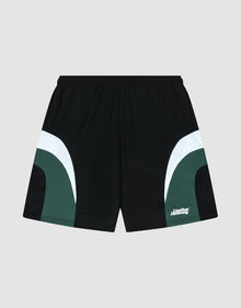 The LIVE FAST DIE YOUNG Basic Trackshorts feature a black oversize fit with dark green and white curved color block side accents, an elastic waistband, and a small white logo print on the lower left leg. Displayed on a light gray background. | plain