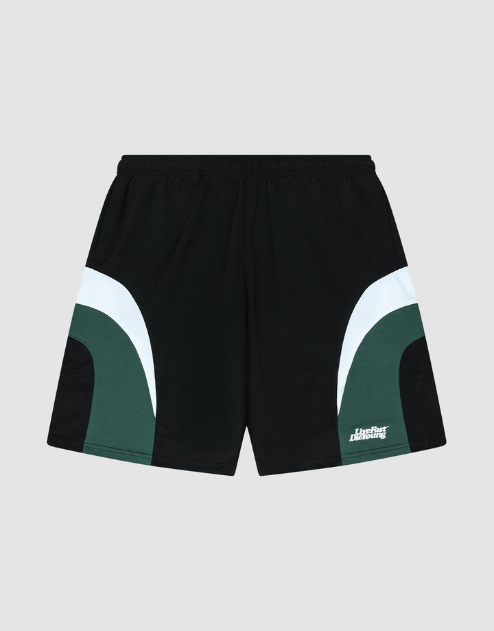 The LIVE FAST DIE YOUNG Basic Trackshorts feature a black oversize fit with dark green and white curved color block side accents, an elastic waistband, and a small white logo print on the lower left leg. Displayed on a light gray background. | plain